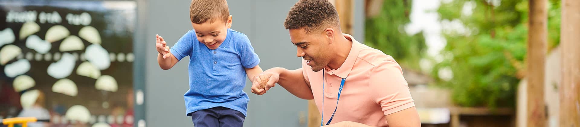 teacher assisting child